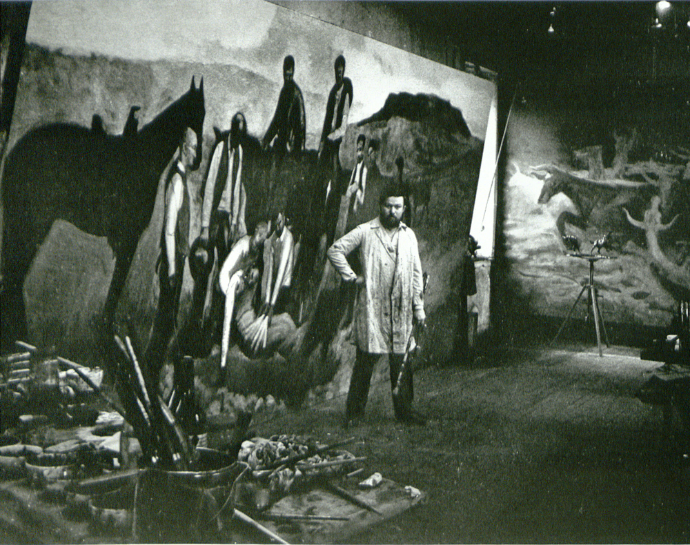1961 Harry Jackson in Broom St Studio with unfinished Range Burial and Stampede paintings